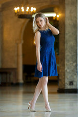 A side view of a Qiviuk & Silk Minerva ladies dress in blue by Qiviuk Boutique