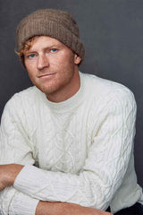 A front view of a white Fisherman Unisex Pullover Merino by Qiviuk Boutique