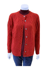 A display of Mena Woman Cardigan Sweater Qiviuk & Merino in red by Qiviuk Boutique